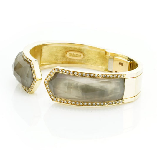Stephen Webster Bangle Bracelet from Crystal Haze Collection; two faceted quartz crystal sections overlay a layer of Mother of Pearl, surrounded by 0.90cts brilliant cut diamonds, in 18ct yellow gold