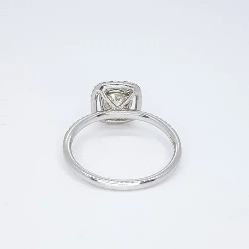 Diamond Halo Cluster Ring, 1.00ct round brilliant-cut diamond surrounded by a halo of diamonds, diamond set shoulders, 1.35 carat total, 18ct white gold