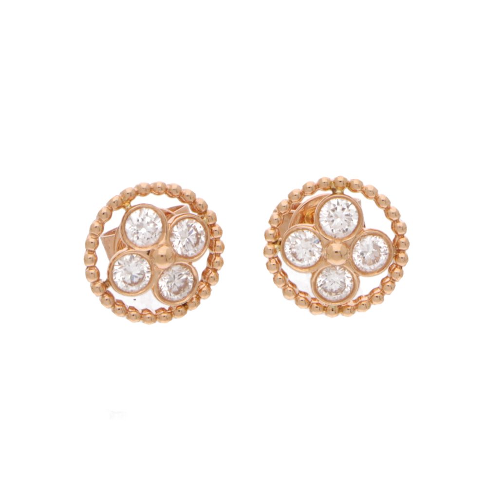 Diamond flower stud earrings in rose gold.
