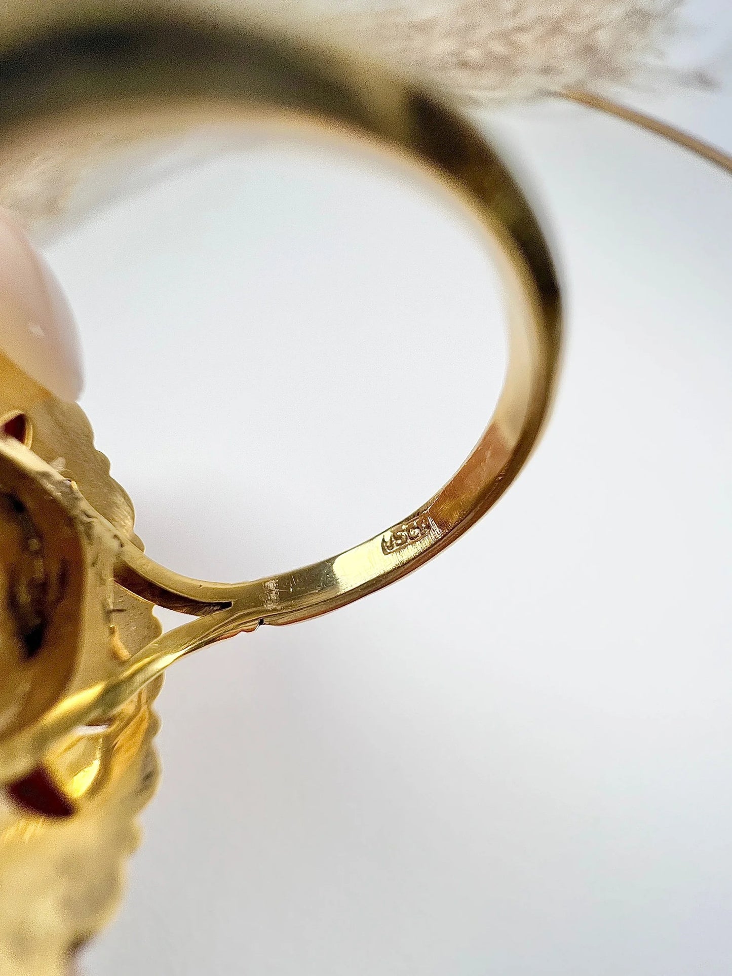 A stamp in a yellow gold ring shank