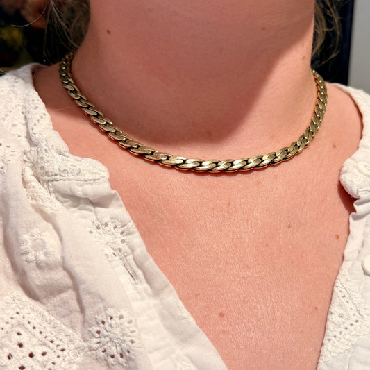 A yellow gold chain necklace, modelled