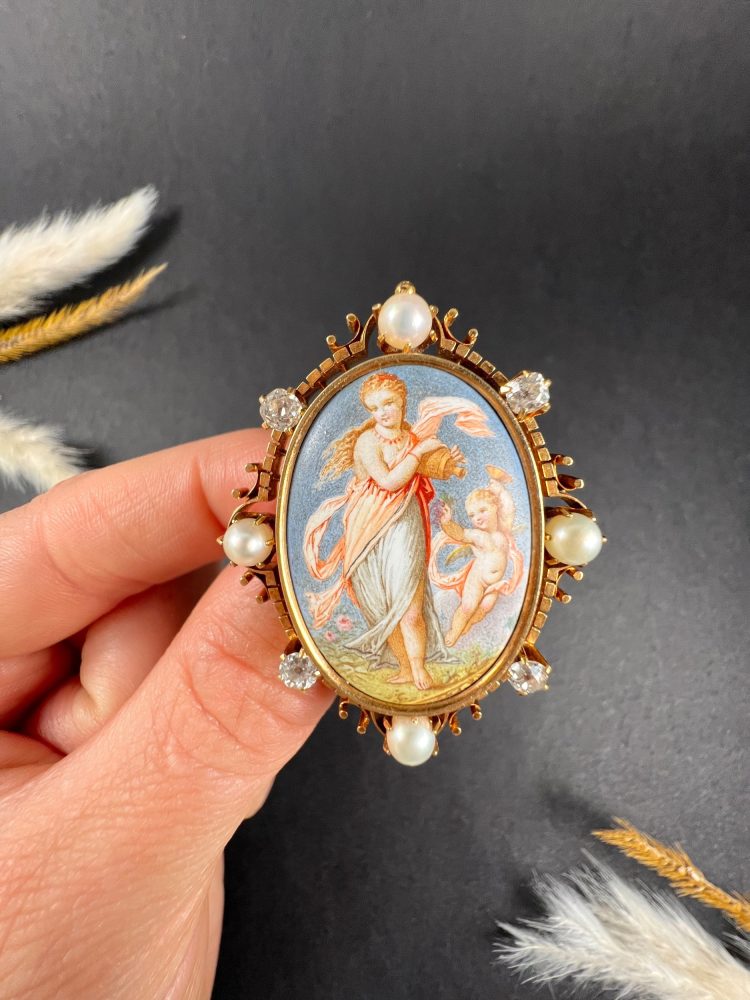Antique enamel, pearl and diamond portrait brooch in gold.