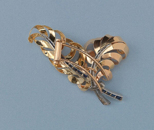 Vintage French Retro 18ct Gold, Diamond and Sapphire Feather Brooch; 18ct rosé and yellow gold feathers set with calibré diamonds and sapphires, with diamond set platinum ribbon.