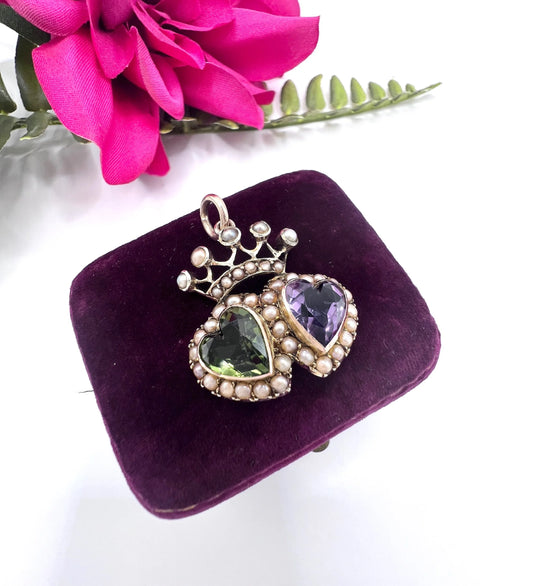 A double heart and crown pendant with peridot, amethyst and pearls in yellow gold