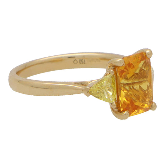 3.05ct Radiant Cut Orange Sapphire and Trillion Cut Fancy Yellow Diamond Three Stone Engagement Ring