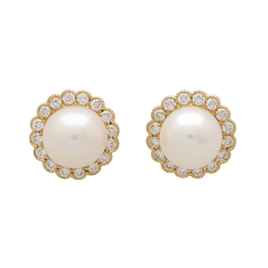 Pearl and diamond earrings in yellow gold.