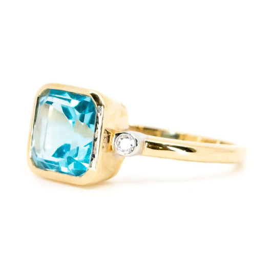 Art Deco Style 14 Carat Yellow Gold Blue Topaz and Diamond Three Stone Ring