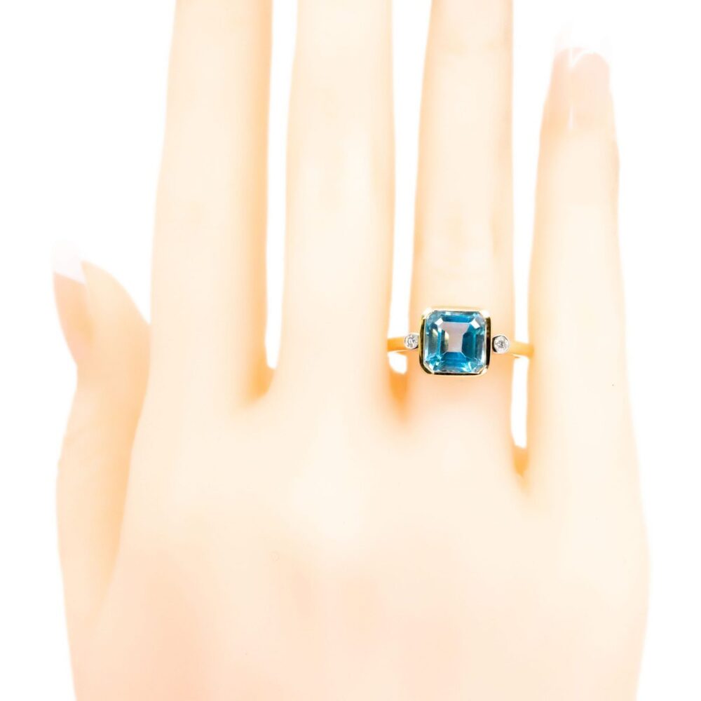 Art Deco Style 14 Carat Yellow Gold Blue Topaz and Diamond Three Stone Ring