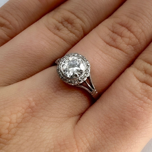 Art Deco diamond halo engagement ring, old cut diamond in platinum