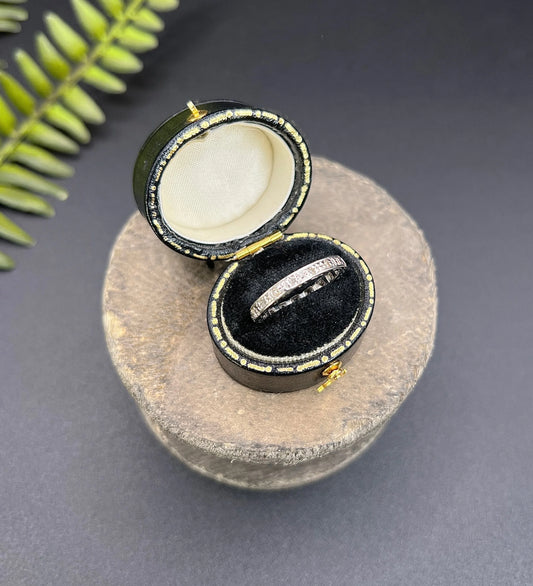 A diamond full eternity ring in white gold, in a ring box