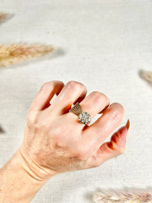 A rose gold diamond set cocktail ring, modelled on a hand
