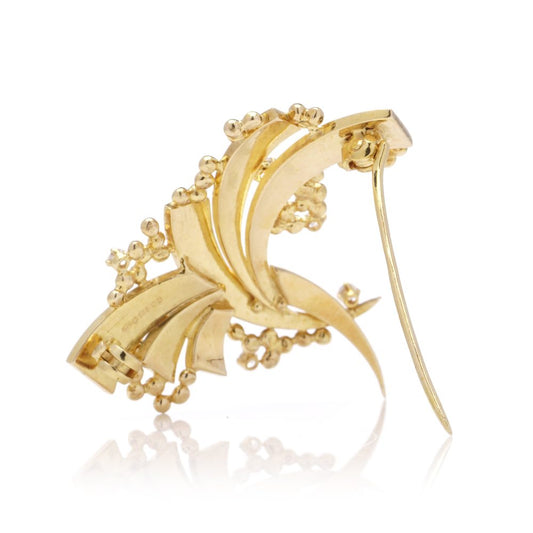 Vintage AMG abstract 18 carat yellow gold and diamond brooch.