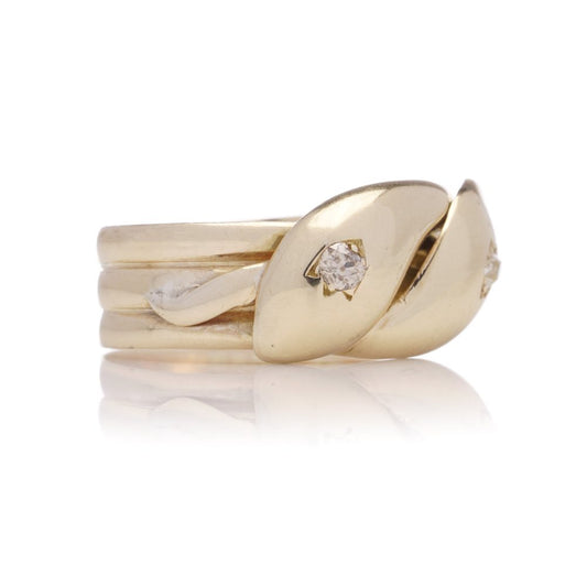 Antique gold men's snake ring set with two diamonds.