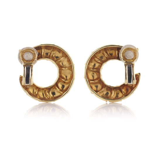 Scalloped clip earrings in gold .
