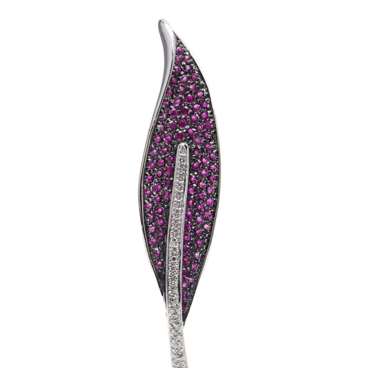 Vintage leaf-shaped brooch with rubies and diamonds in white gold.