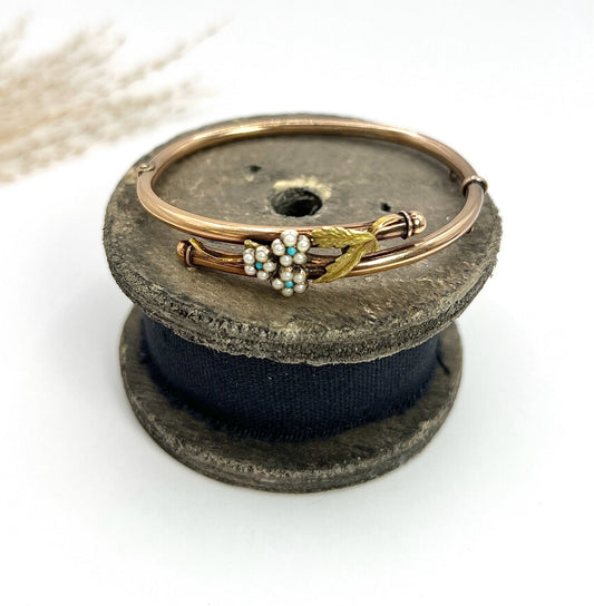 A rose and yellow gold floral bangle bracelet with turquoise and pearls