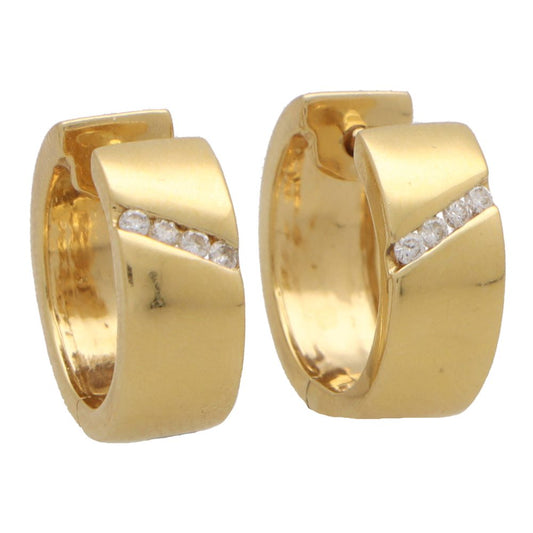 Vintage diamond hoop earrings in yellow gold.
