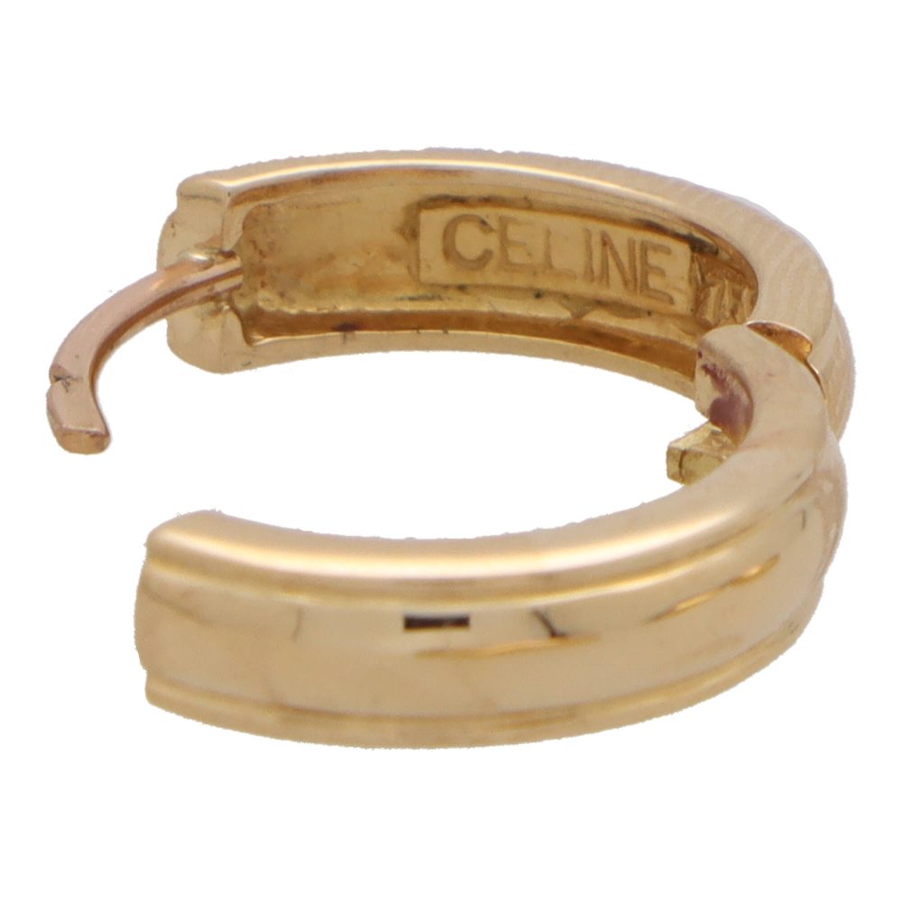 Celine logo detachable hoop earrings in yellow gold.