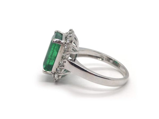 Emerald Cut Emerald and Diamond Cluster Ring in 18ct White Gold