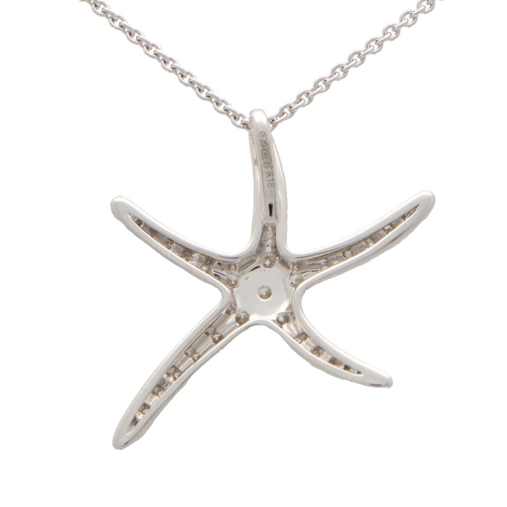 Diamond starfish pendant necklace in white gold.
