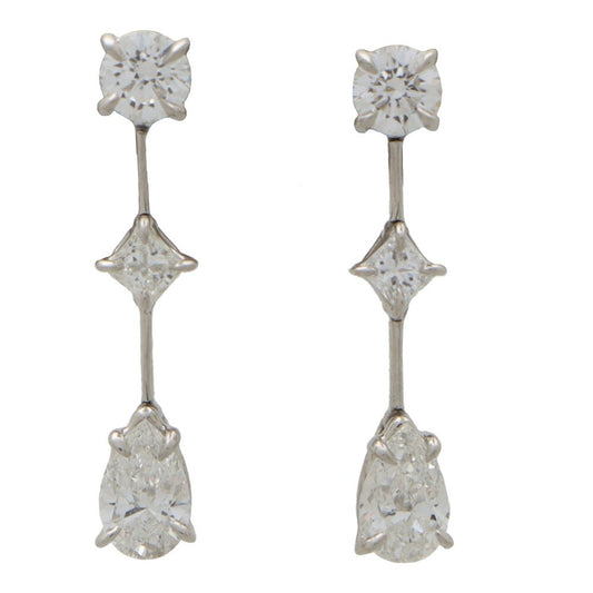 Cascading diamond drop earrings in platinum.