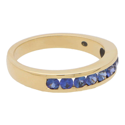 Blue Sapphire Half Eternity Ring In 18 Carat Yellow Gold