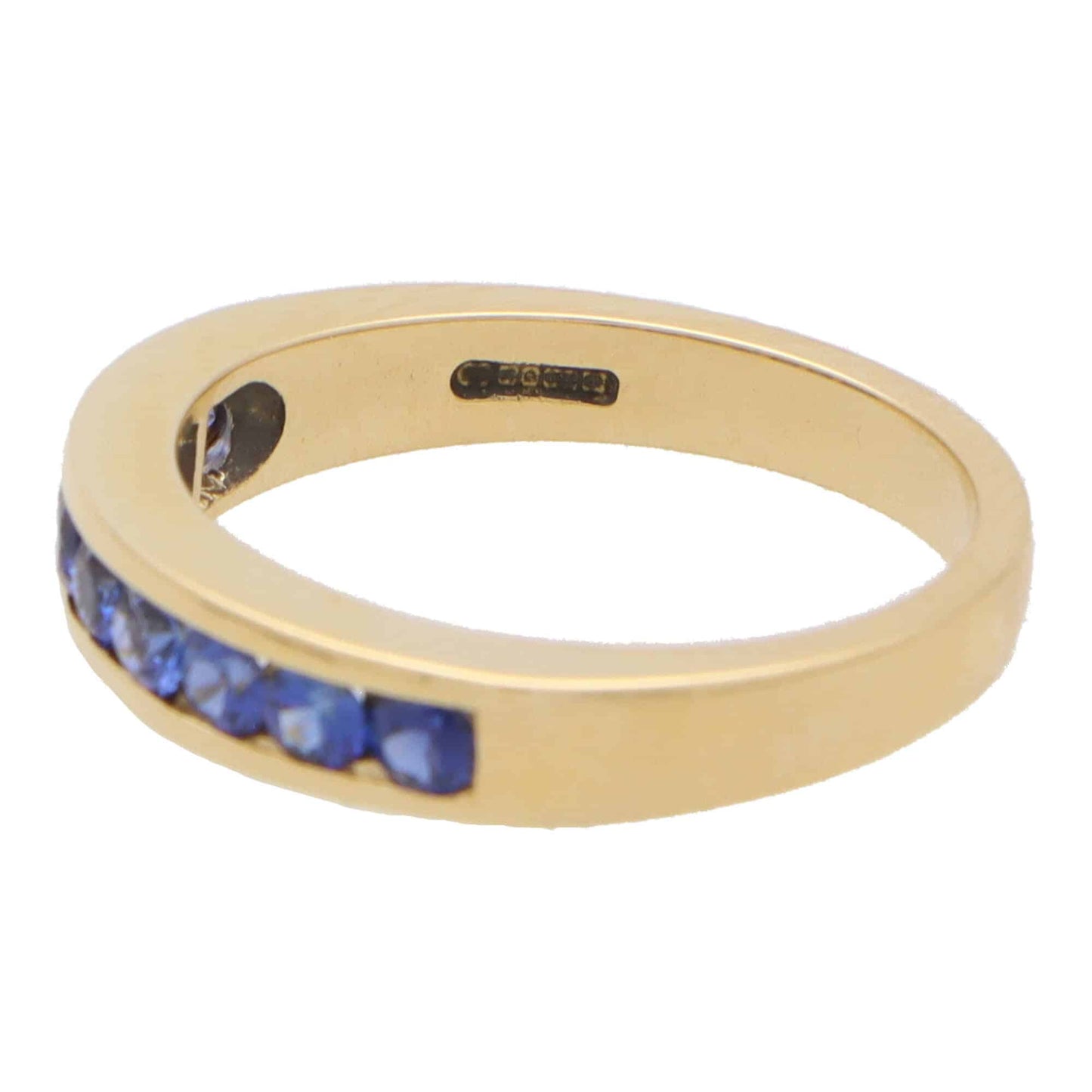 Sapphire half eternity ring set in 18 carat yellow gold.