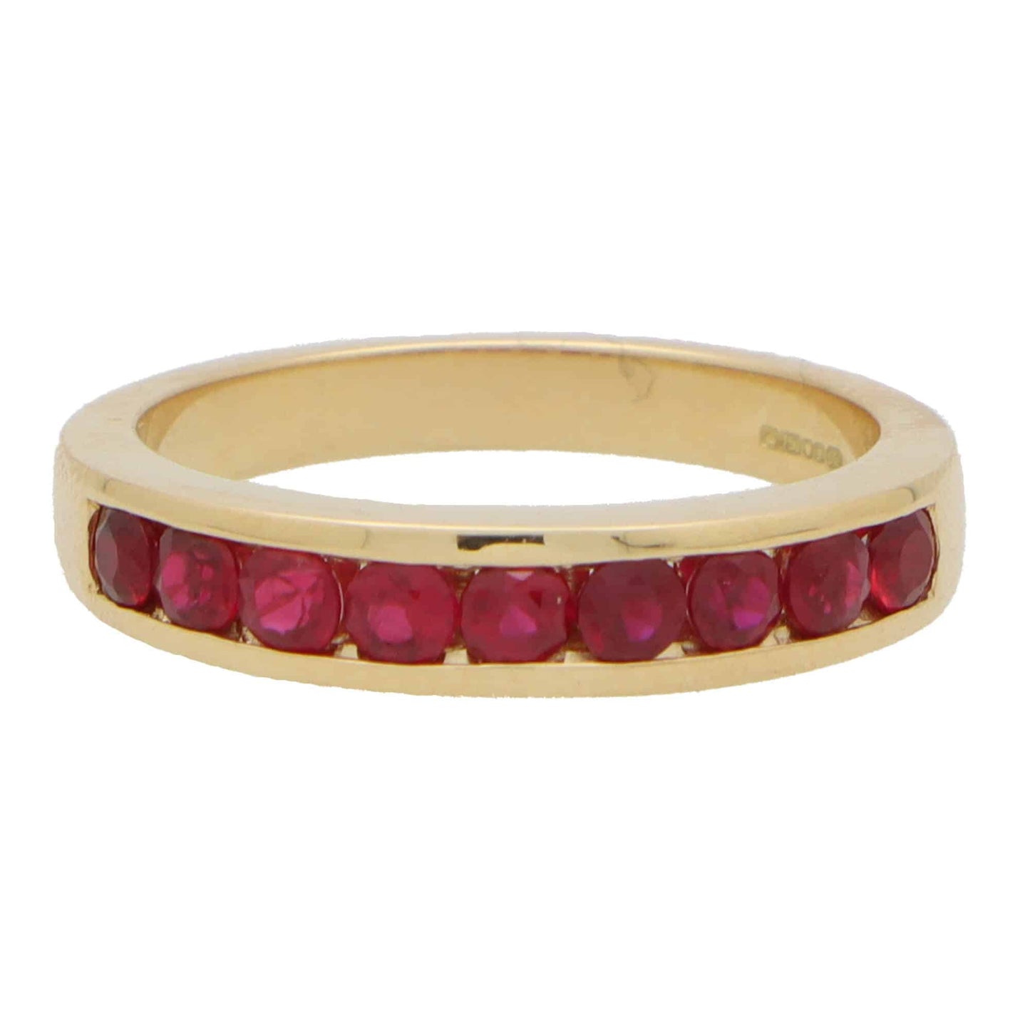 Ruby half eternity ring set in 18 carat yellow gold.