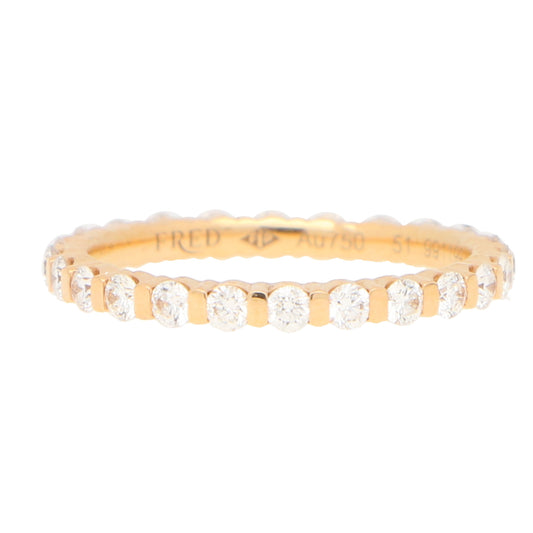 A round diamond full eternity band ring in gold, stamped FRED Au750 51, on a white background