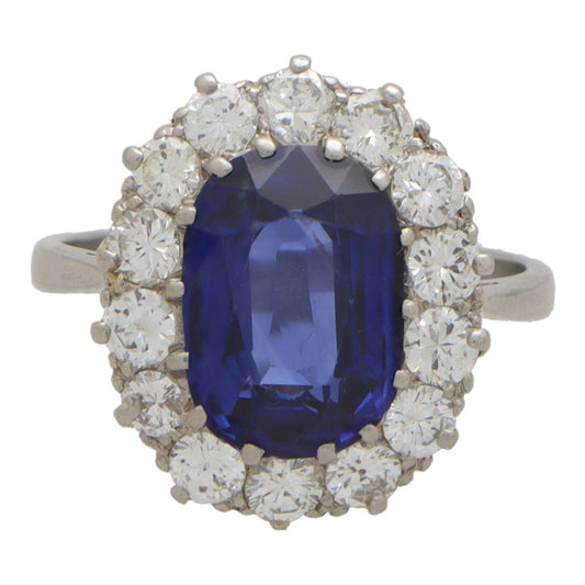 3.66 carat sapphire and diamond cluster ring in platinum.