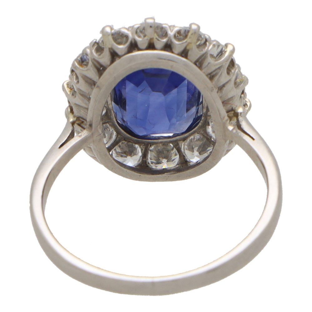 3.66 carat sapphire and diamond cluster ring in platinum.