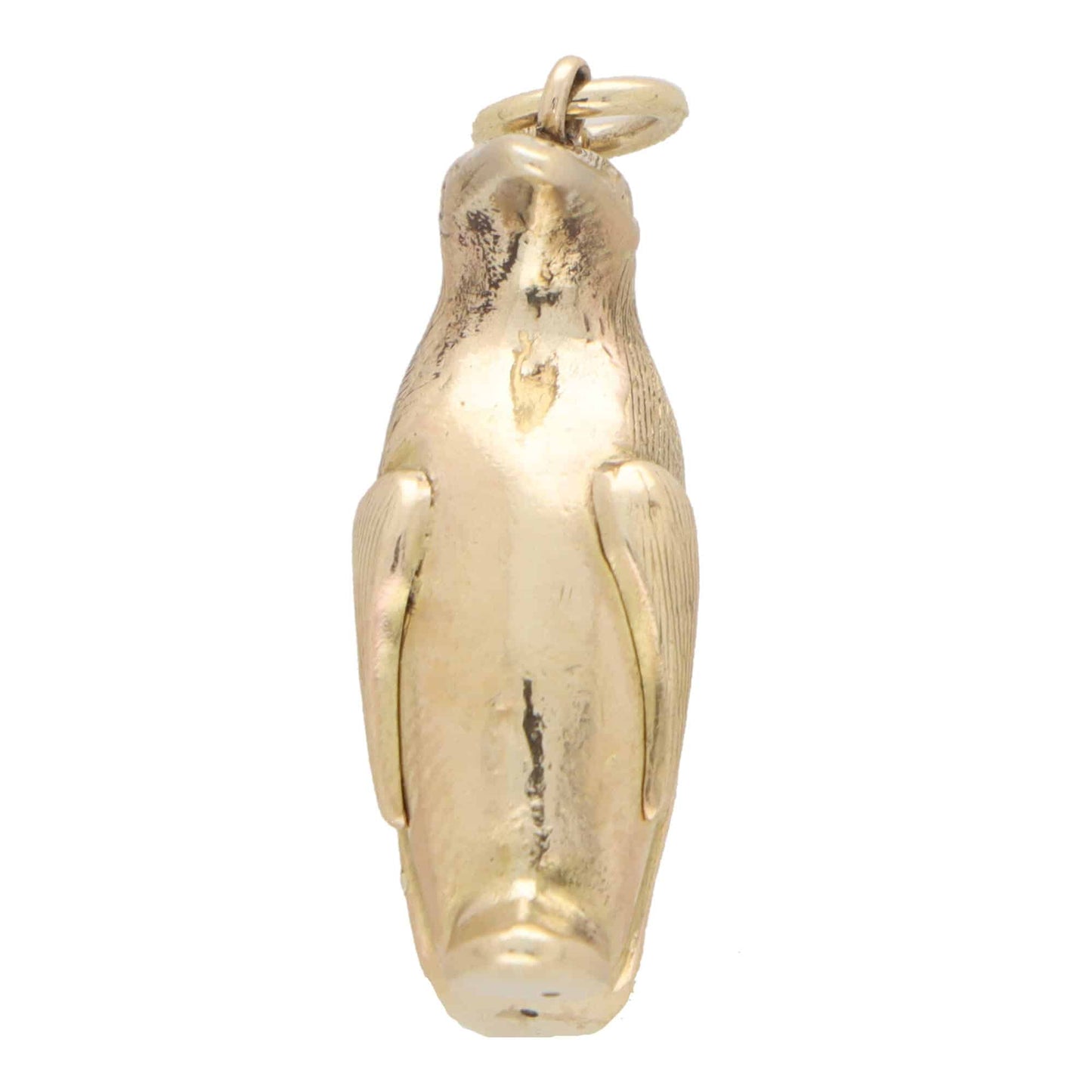 A yellow gold penguin charm, on a white background