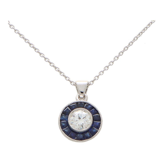 Diamond and sapphire target necklace in white gold.