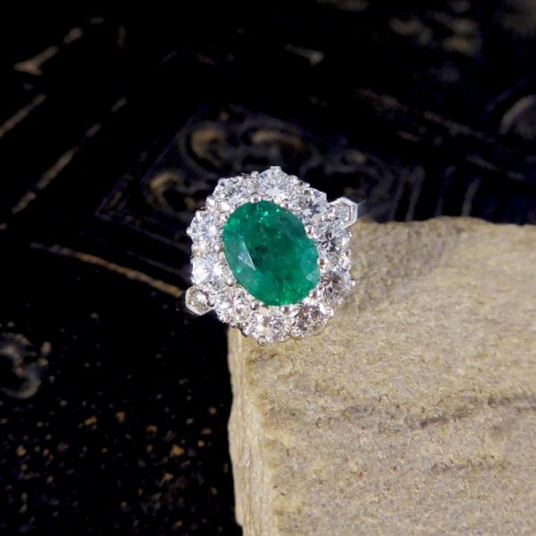 Oval 1.37ct Emerald and 1.00ct Diamond Cluster Ring