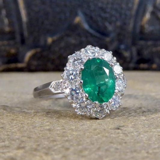 Oval 1.37ct Emerald and 1.00ct Diamond Cluster Ring
