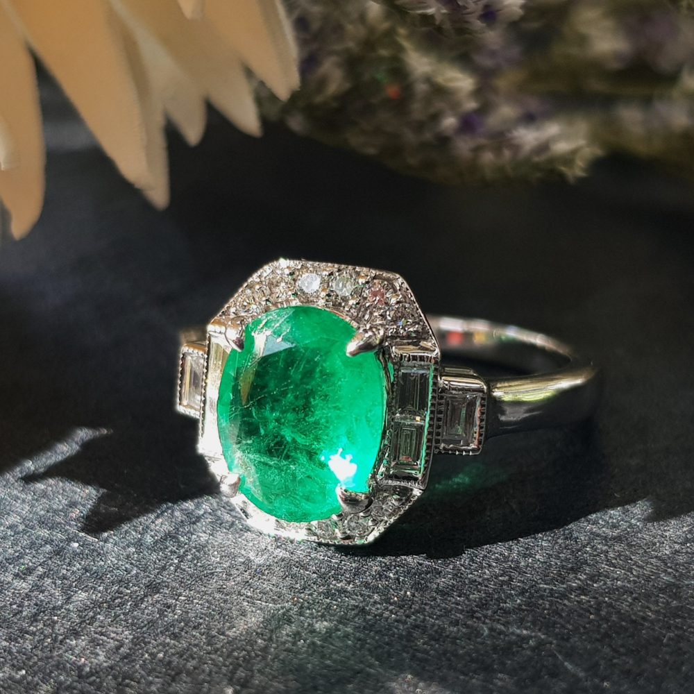 Contemporary 1.70ct Oval Cabochon Emerald and Diamond Cluster Ring
