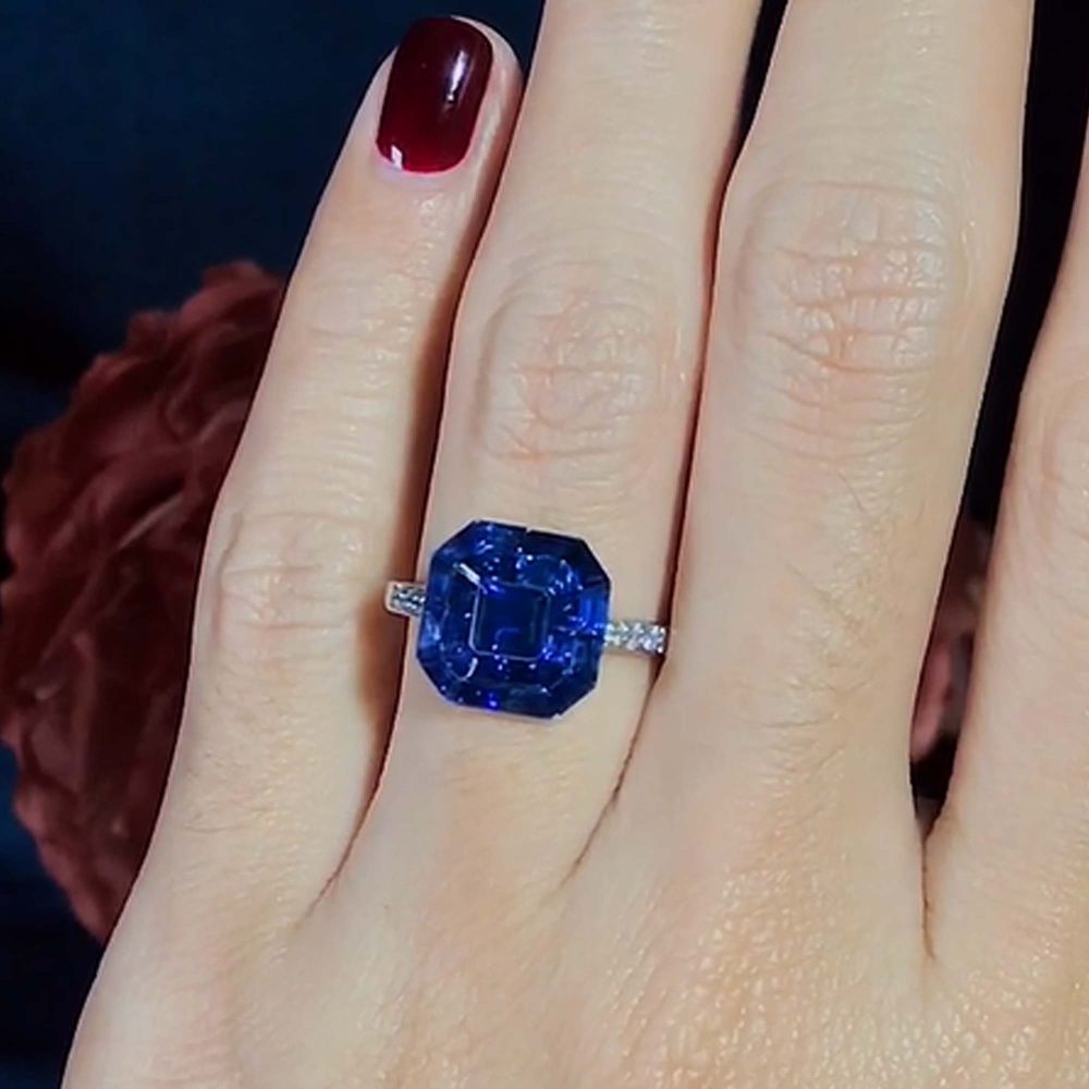 Octagonal Sapphire Cluster Solitaire Engagement Ring, 5.72cts multi asscher and calibre cut sapphires arranged in invisible setting to produce an octagonal shaped design
