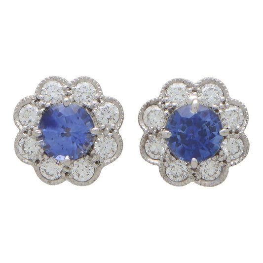 Sapphire and diamond floral cluster earrings in white and yellow gold.