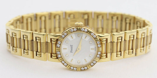 Piaget Diamond Dancer Watch in 18K Yellow Gold. Mother of pearl dial with diamond hour markers. and diamond set bezel. With Box. Quartz