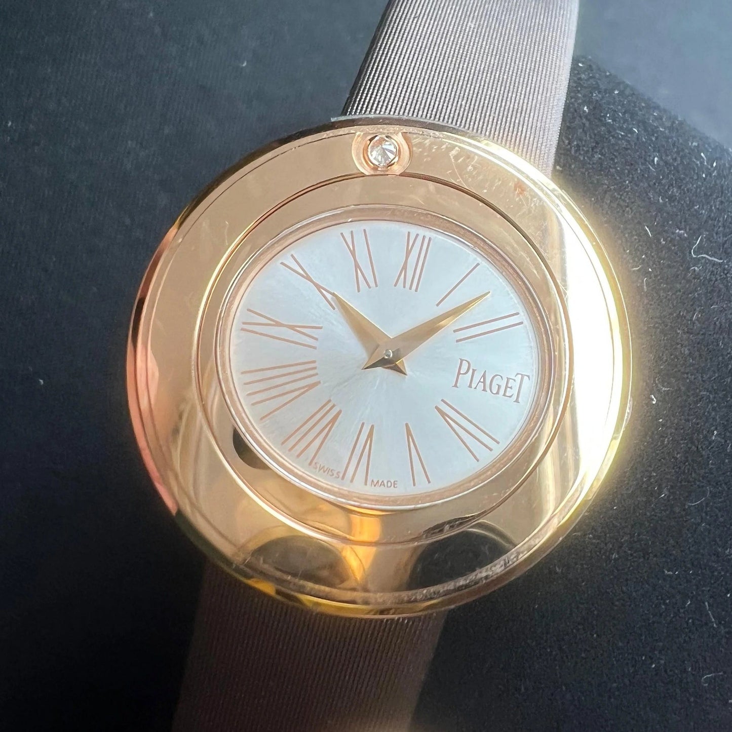 A yellow gold Piaget wristwatch with oval dial, Roman numerals and gold hands