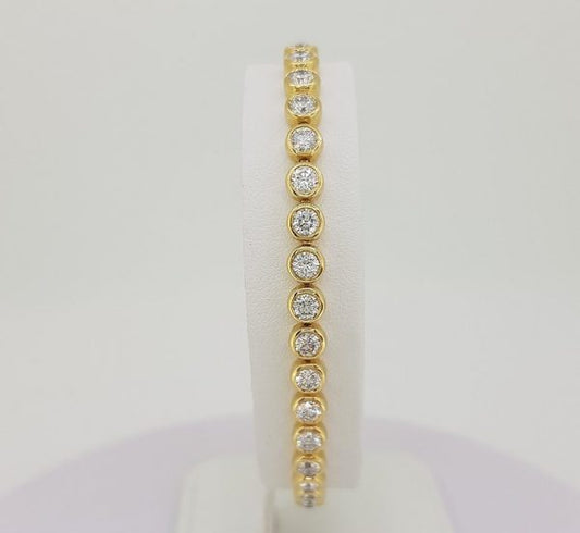 Tennis line bracelet yellow gold diamond line rubover bezel setting