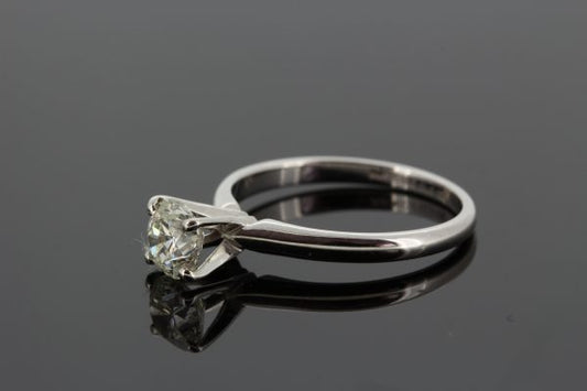 Single Stone Diamond Solitaire Engagement Ring; featuring a 1.01 carat diamond four claw set in a high crown mount in 14ct white gold