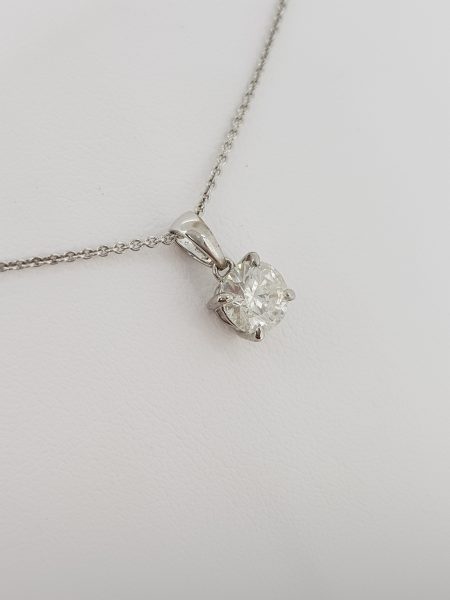 Single Stone Diamond Solitaire Pendant; certified 1.05ct F SI2 diamond, four claw set in 18ct white gold