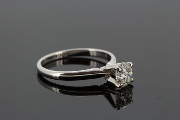 Single Stone Diamond Solitaire Engagement Ring; featuring a 1.01 carat diamond four claw set in a high crown mount in 14ct white gold