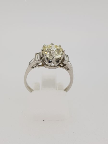 2.26ct Diamond Solitaire Engagement Ring in Platinum; central 2.26 carat round brilliant-cut diamond with 0.38cts baguette-cut diamond set shoulders