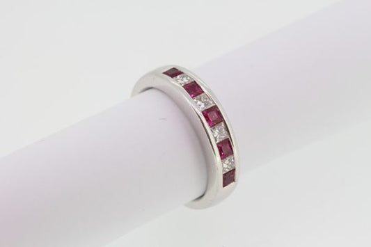 Princess Cut Ruby and Diamond Half Eternity Ring; channel-set with alternating square-cut rubies and princess-cut diamonds, in 18ct white gold