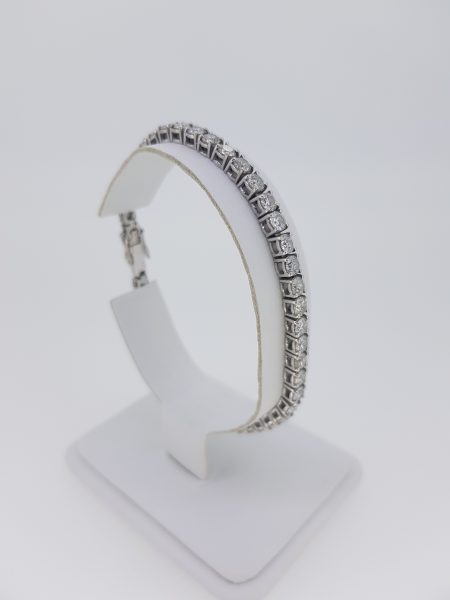 Diamond Line Bracelet in 18ct White Gold, 9.40 carat total; claw set with 9.40 carats of round brilliant-cut diamonds, in 18ct white gold