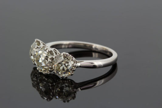 Old Cut Diamond Three Stone Ring, 3.65 carat total; central 1.51ct diamond flanked by 1.07ct diamond either side, in 18ct white gold