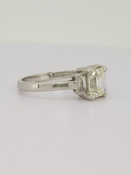 Emerald Cut Diamond Ring with Baguette Diamond Shoulders; 1.03 carat emerald-cut diamond, flanked by 0.24cts baguette cut diamonds, in 18ct white gold