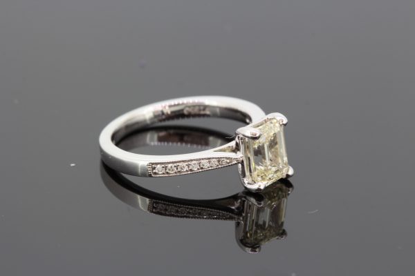 Emerald Cut Diamond Engagement Ring in Platinum; 1.53ct emerald-cut diamond flanked by tapered shoulders set with round brilliant-cut diamonds